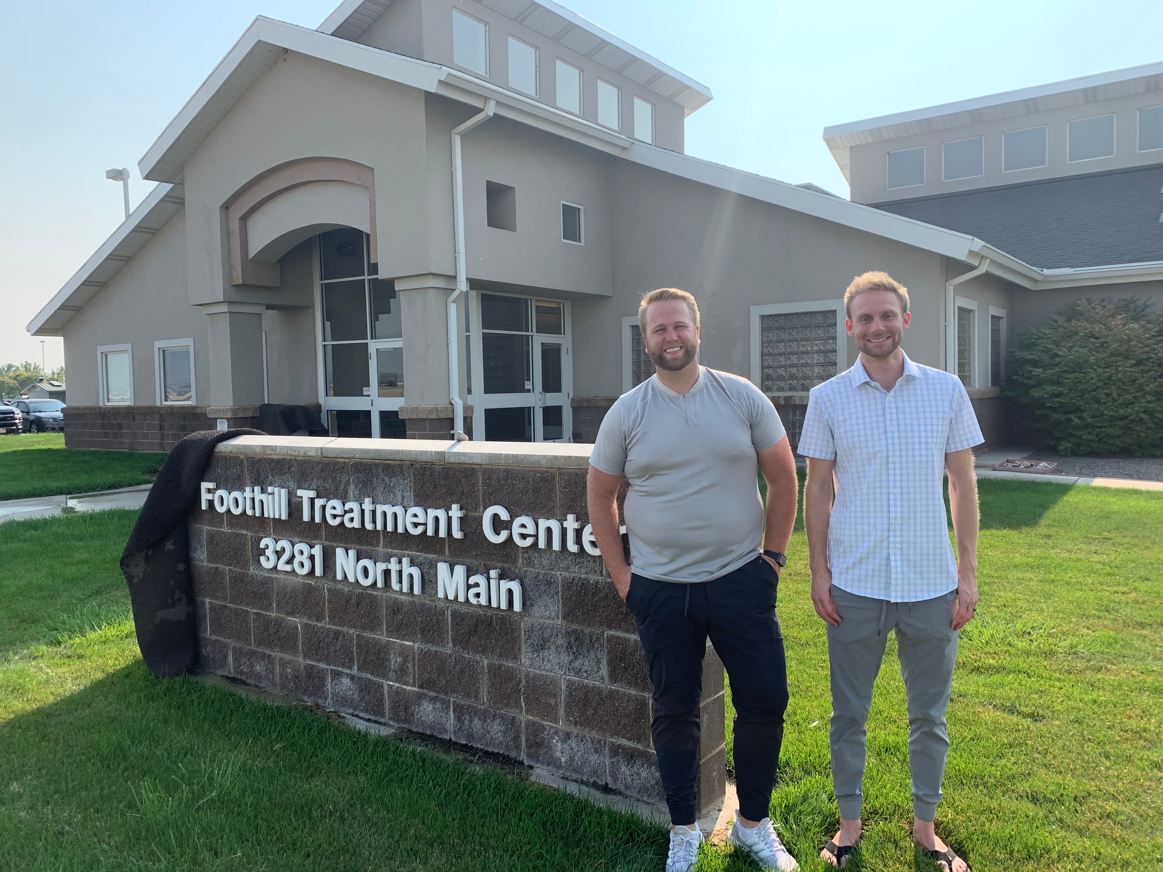 Owners of Truwear standing in front of Foothill treatment center