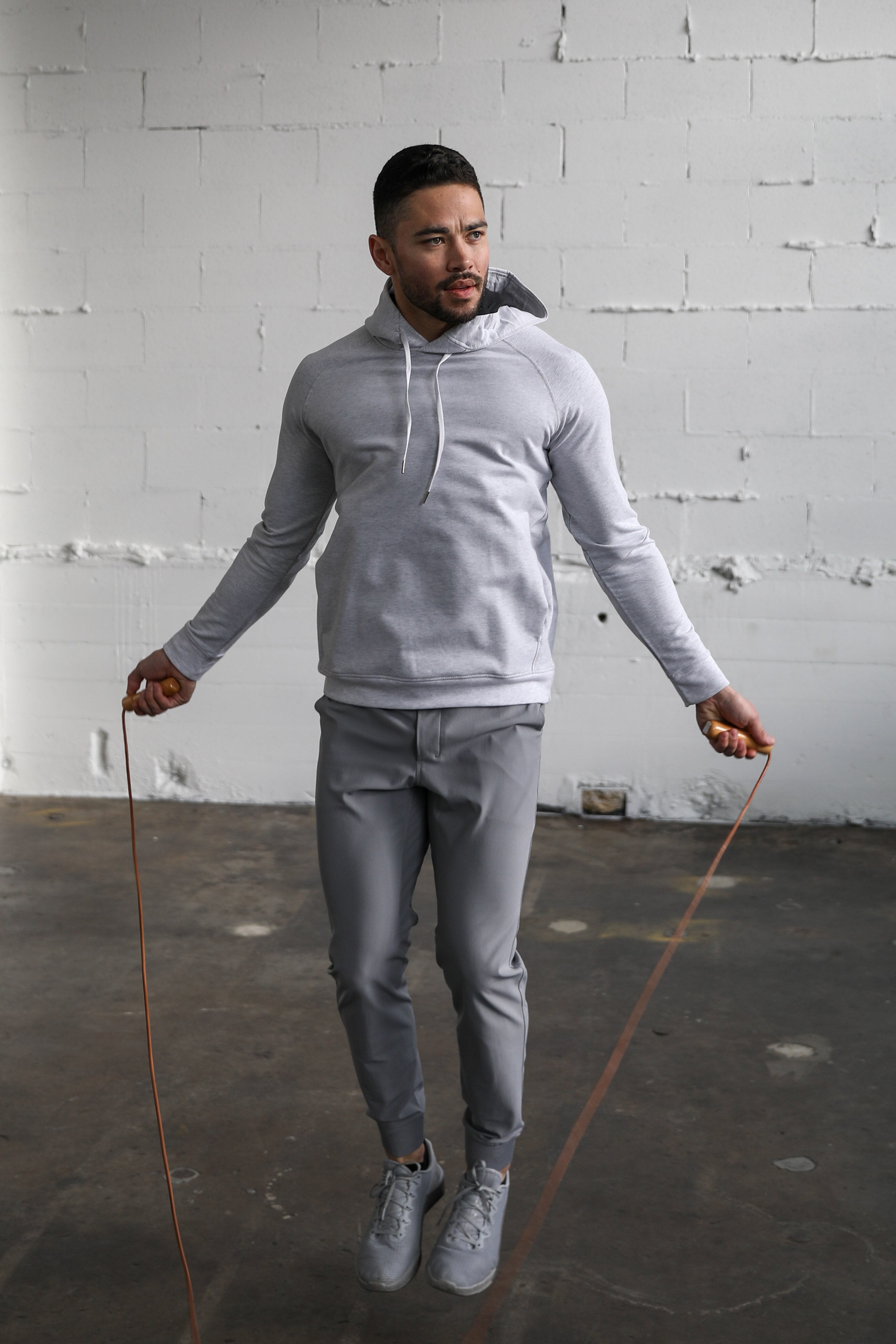 Man jump roping in Truwear hoodie and joggers