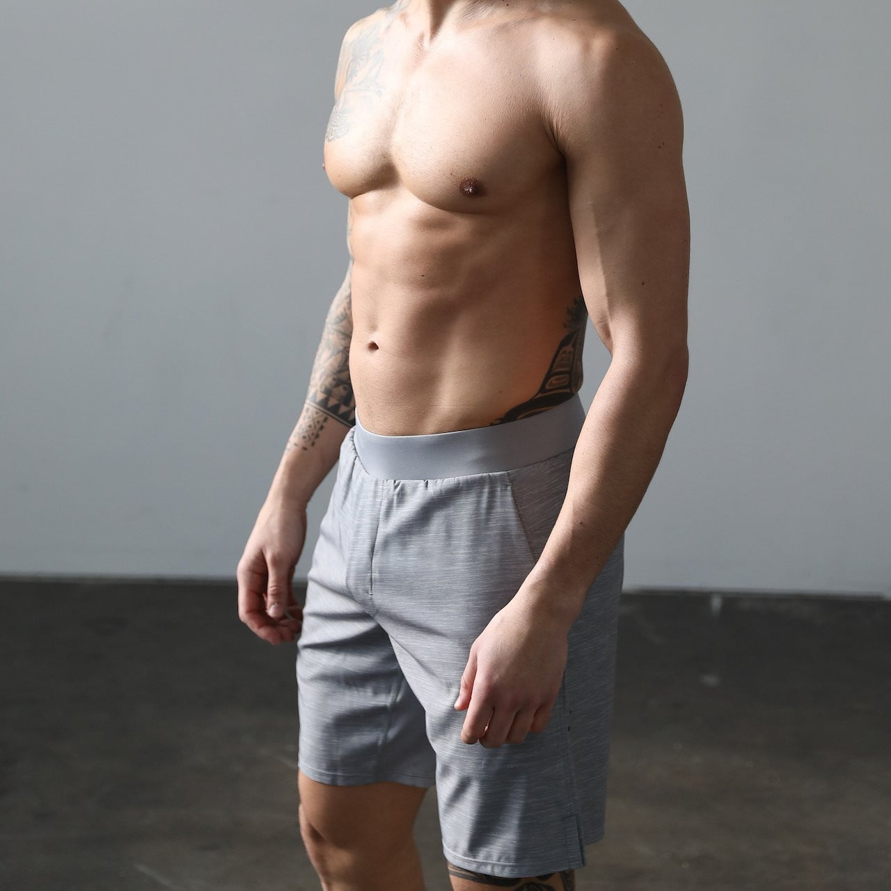 Shirtless man wearing Truwear running shorts